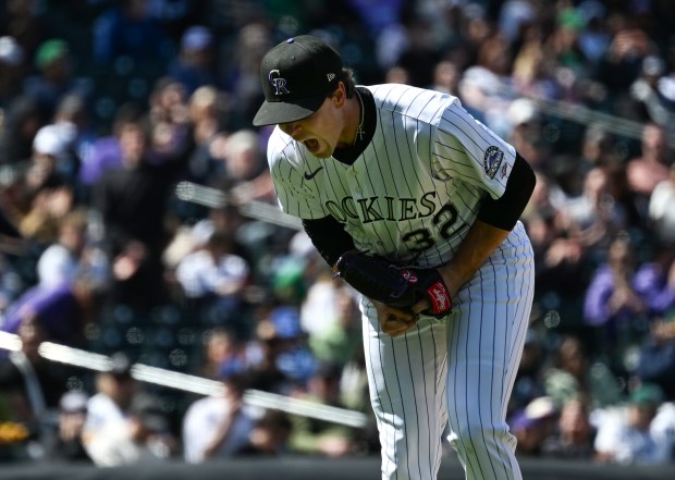 Colorado Rockies rookie pitcher Chase Dollander prepares to deliver a pitch at Coors Field
