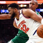 Karl-Anthony Towns grabbing a rebound during the NBA Playoffs