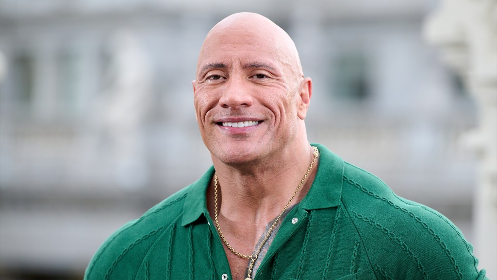 Dwayne Johnson smiling at a film premiere