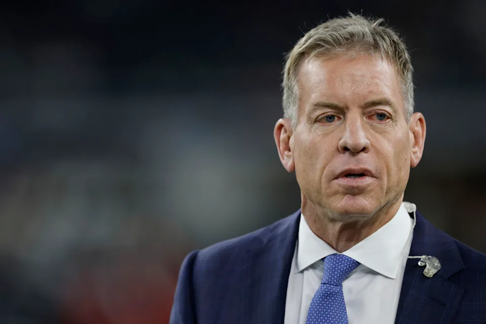 Troy Aikman during a broadcast, engaging with fans and sharing his insights on the NFL.