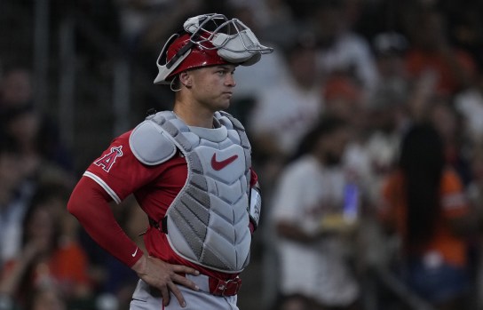 Padres outfielder fields ball during intense ninth inning of Padres game