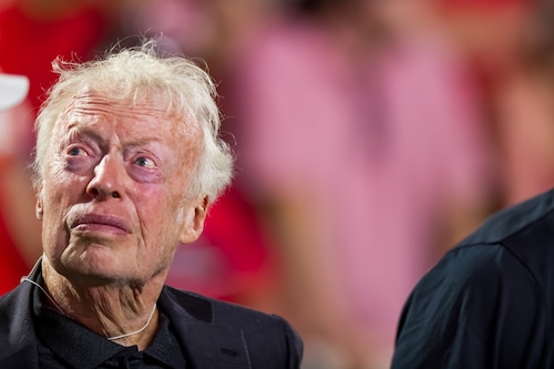 Phil Knight at a sports event, symbolizing his influence on Portland and Nike
