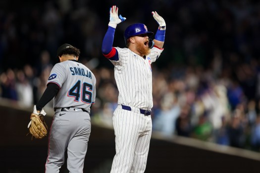 Justin Turner celebrates after his walk-off double for the Cubs