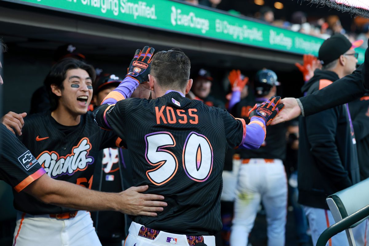 Christian Koss celebrates his grand slam for the Giants