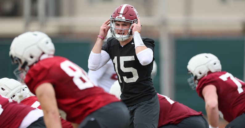 AJ McCarron celebrating on the field, highlighting his Alabama football legacy
