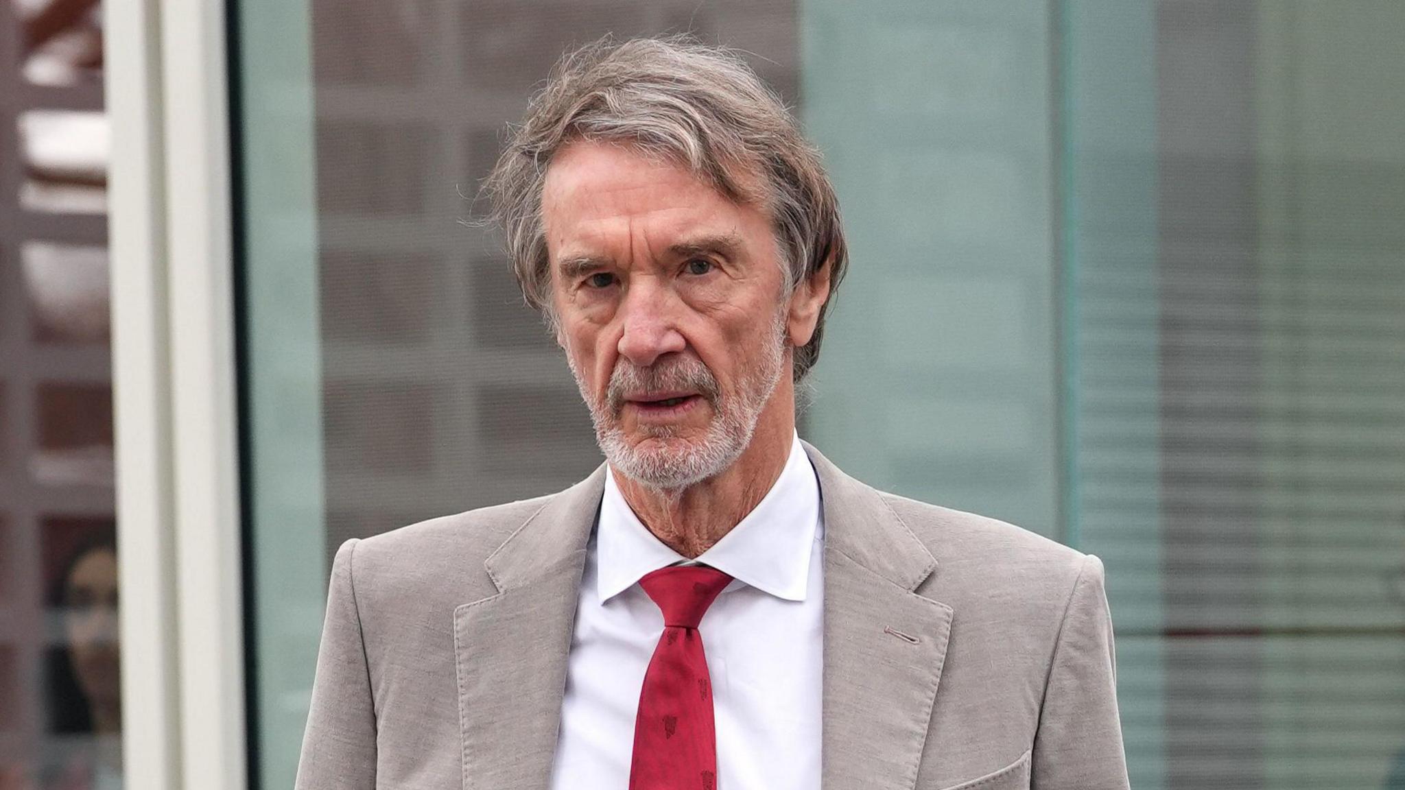 Sir Jim Ratcliffe with Man U branding at Old Trafford