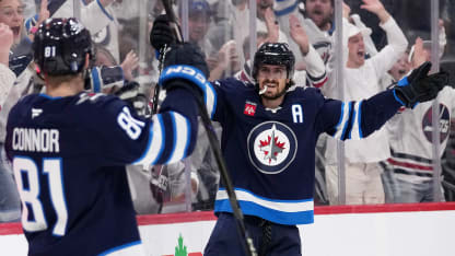 Intense hockey action as the Stars face the Jets in the NHL playoffs