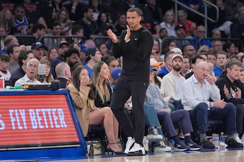 Celtics coach Joe Mazzulla strategizes courtside during an NBA playoff game