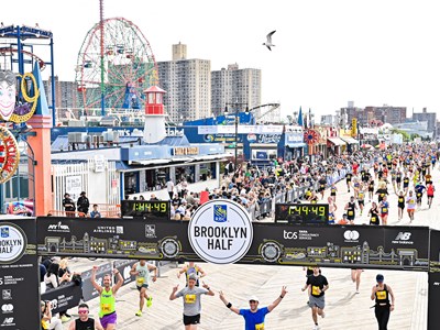 Runners crossing the finish line at the Brooklyn Half Marathon