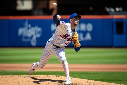 Griffin Canning pitches during a game for the New York Mets