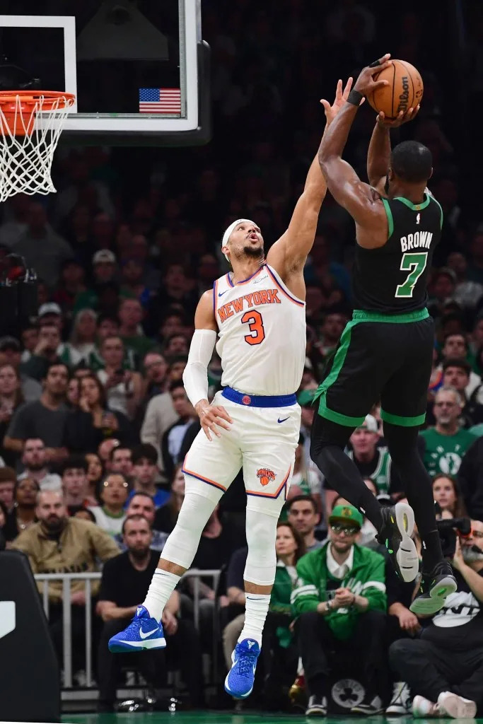 Josh Hart wipes blood from his eyebrow after injury in Game 5, embodying the Josh Hart eye determination. 