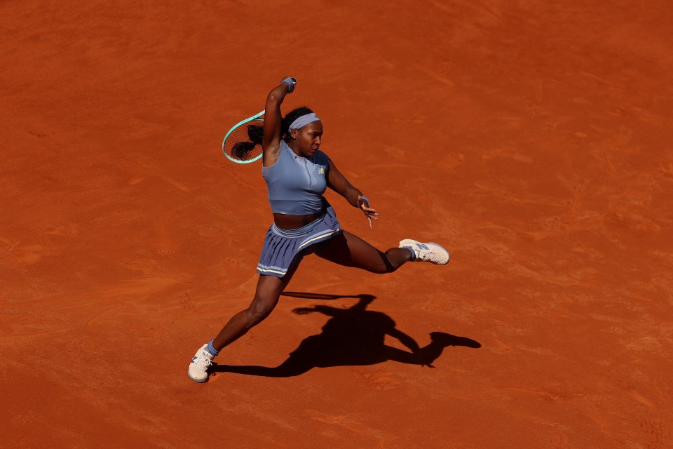 Coco Gauff celebrating during a clay-court match, embodying the spirit of WTA rankings progress