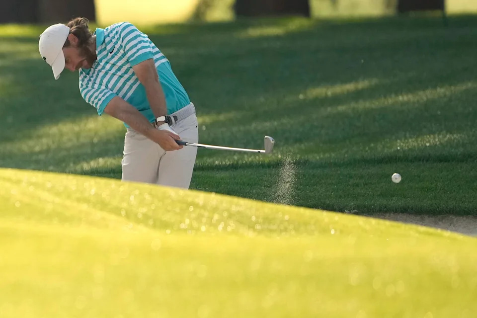 Tommy Fleetwood lines up his eagle putt at the PGA Championship, demonstrating composure and skill.