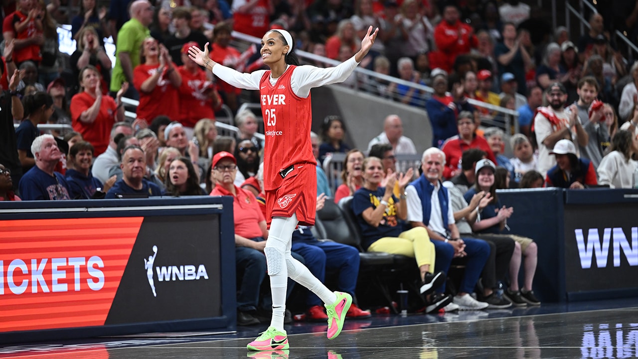 DeWanna Bonner celebrates a historic scoring achievement in the WNBA.