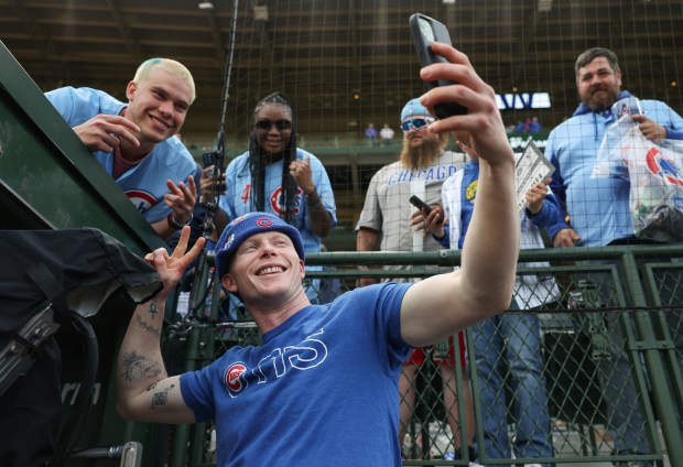 Pete Crow Armstrong celebrates with Cubs fans after a win against the White Sox in 2025.