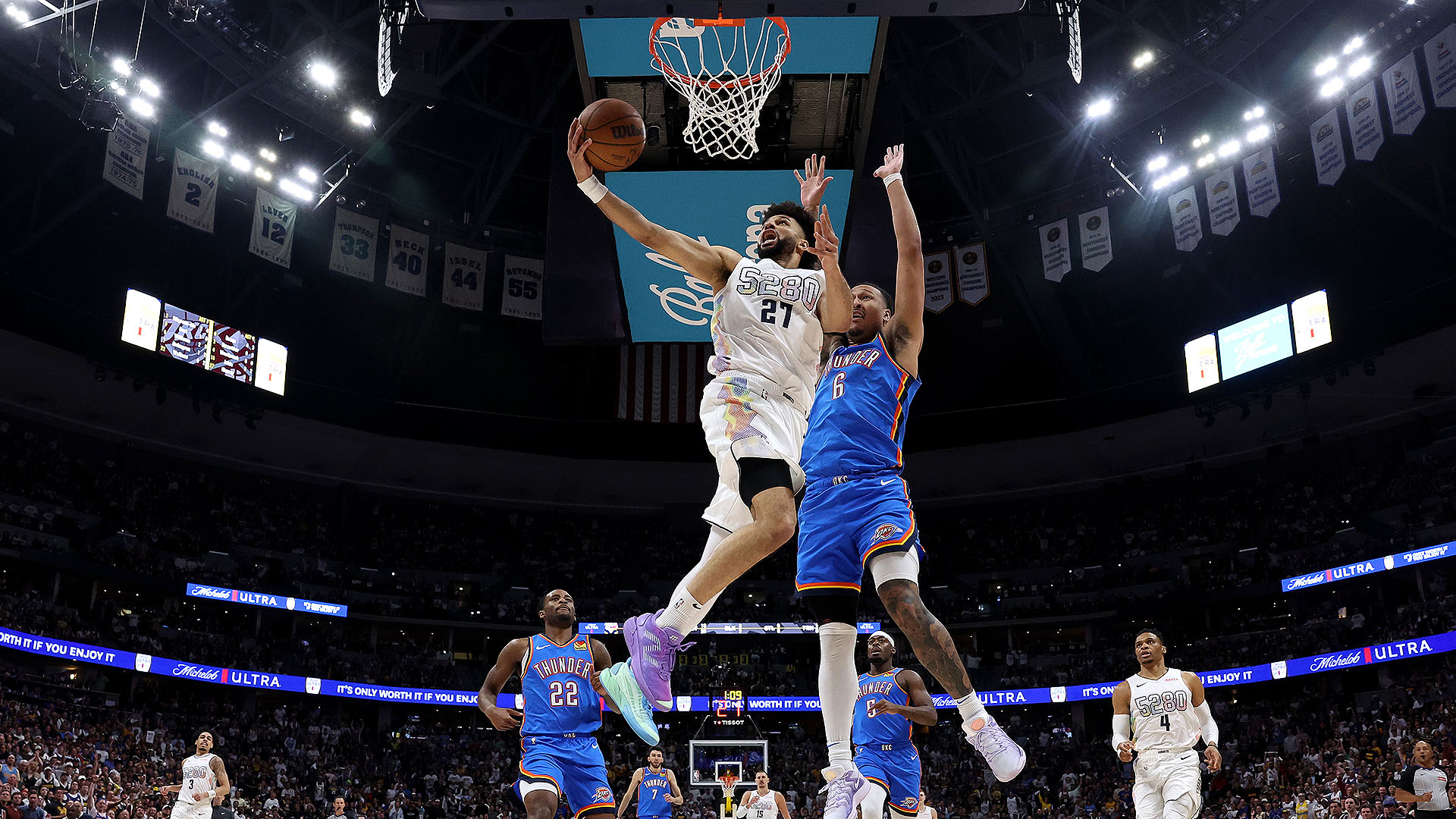 Shai Gilgeous-Alexander driving against Nuggets defenders in OKC vs Nuggets Game 7