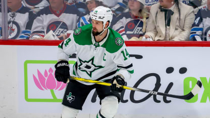 Jamie Benn in action on the ice, leading the Dallas Stars