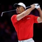 Tiger Woods swinging his golf club at a major tournament