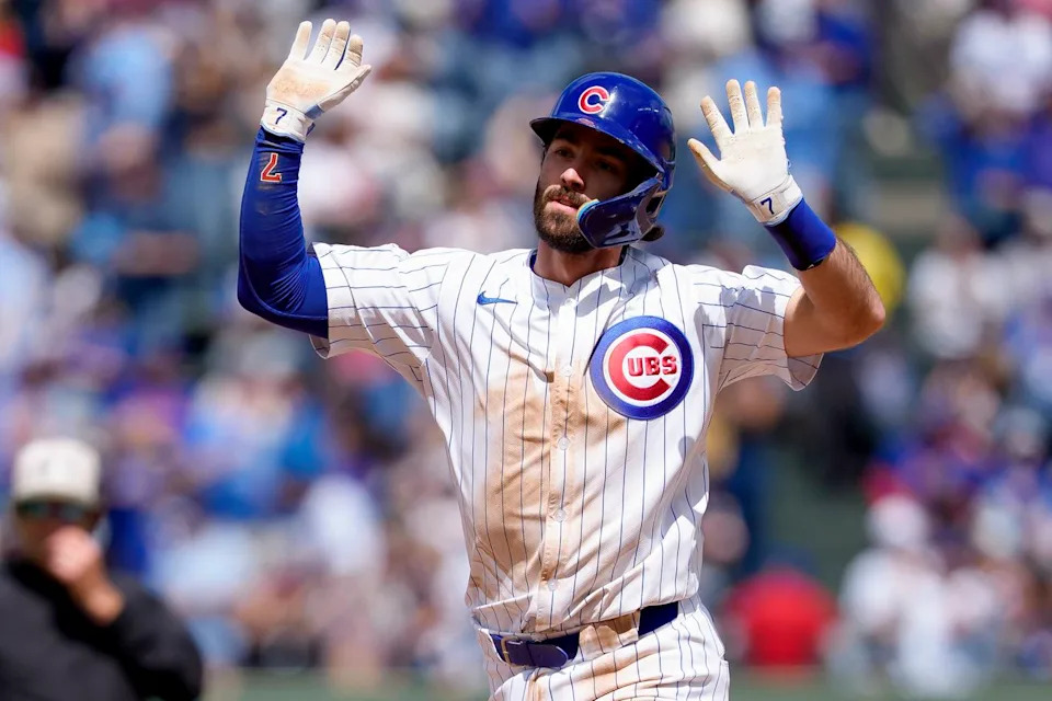 Colin Rea delivers a pitch during a high-stakes Chicago Cubs game at Wrigley Field