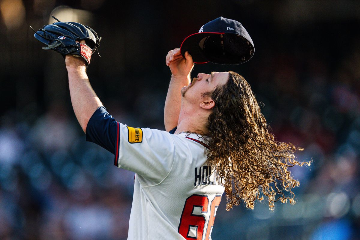 Grant Holmes delivers a pitch for the Atlanta Braves at Fenway Park