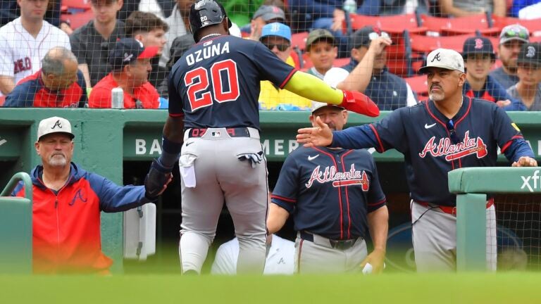 Marcell Ozuna celebrates after a powerful home run against the Red Sox.