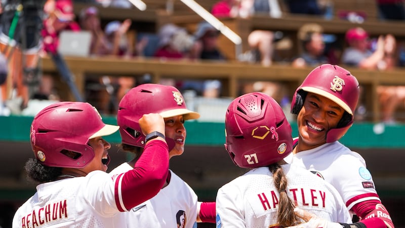 FSU softball athletes celebrating a win in the NCAA tournament