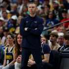 Nuggets coach David Adelman giving instructions to players