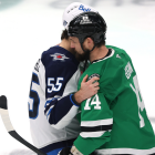 NHL referee Chris Rooney receives medical attention after injury in playoff game