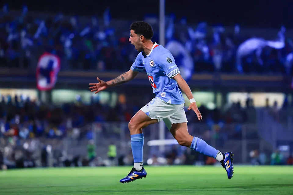 Cruz Azul players celebrate a goal against América in the Liga MX semifinal