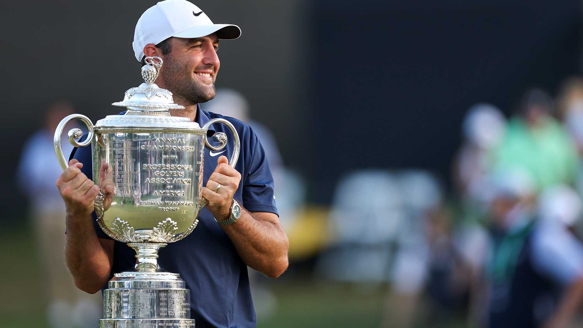 Scottie Scheffler holds the PGA Championship trophy, representing the 2025 PGA Championship payout