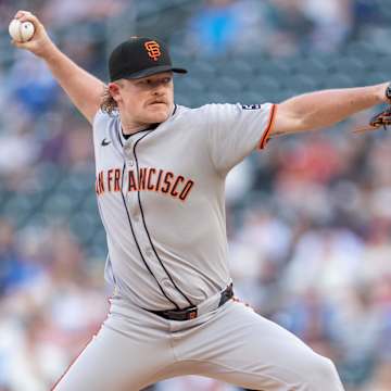 San Francisco Giants pitcher delivers a fastball during a tense late-inning situation at Oracle Park in 2025