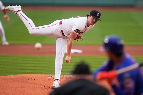 Hunter Dobbins delivers a pitch in Fenway Park, helping the Red Sox secure a win over the Mets