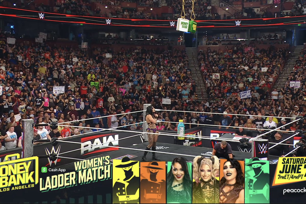 Rhea Ripley celebrates after her Money in the Bank qualifier victory on WWE Raw