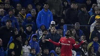 Boca Juniors player tries to stop Independiente's attacker at La Bombonera