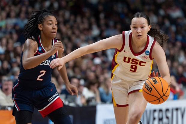 Kayleigh Heckel drives to the basket for UConn.
