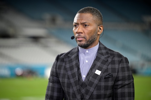 Ryan Clark with his wife at a sports event